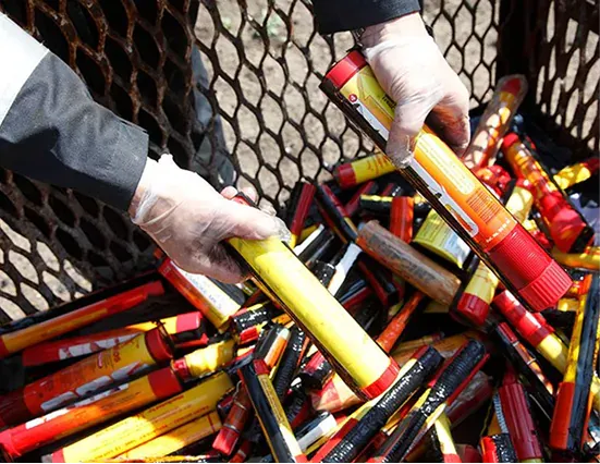 Marine pyrotechnic distress signals being handled